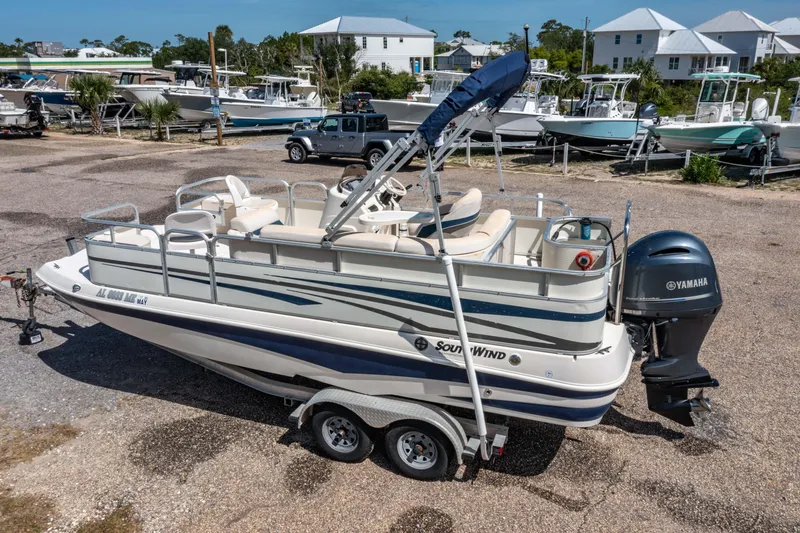 Slide: The Image of 2008 Bennington 201FS Southwind boat with Yamaha motor on a trailer in a marina. - 9