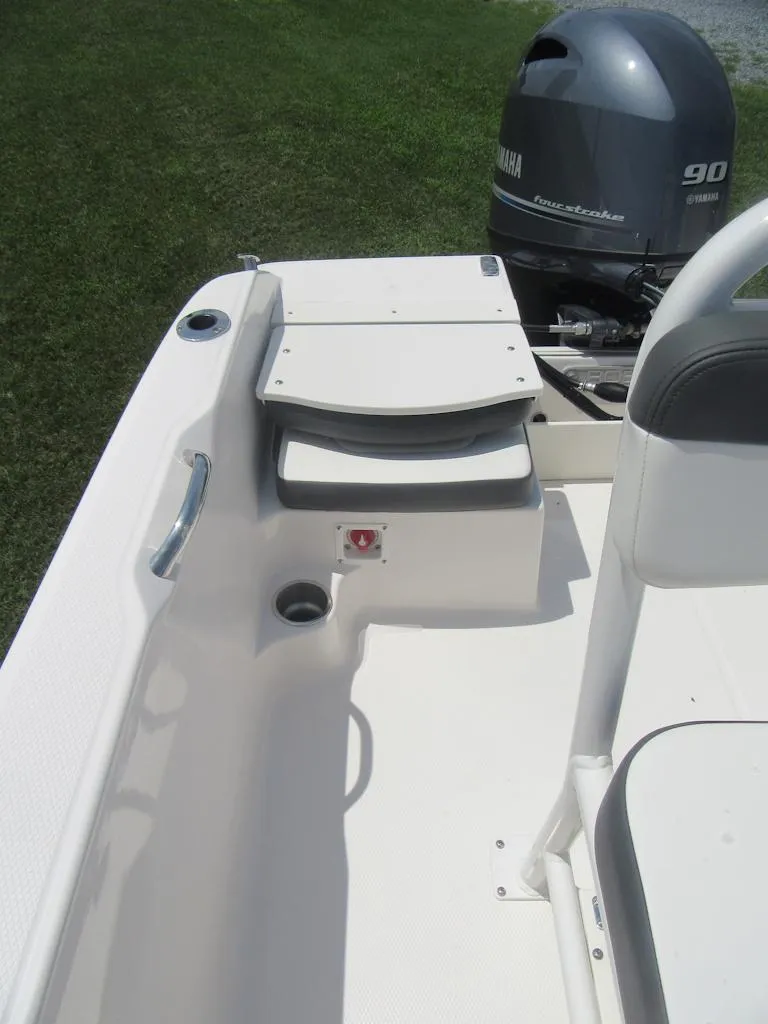 Slide: The Image of 2025 Robalo R160 Center Console boat interior with Yamaha engine, featuring seating and storage. - 10