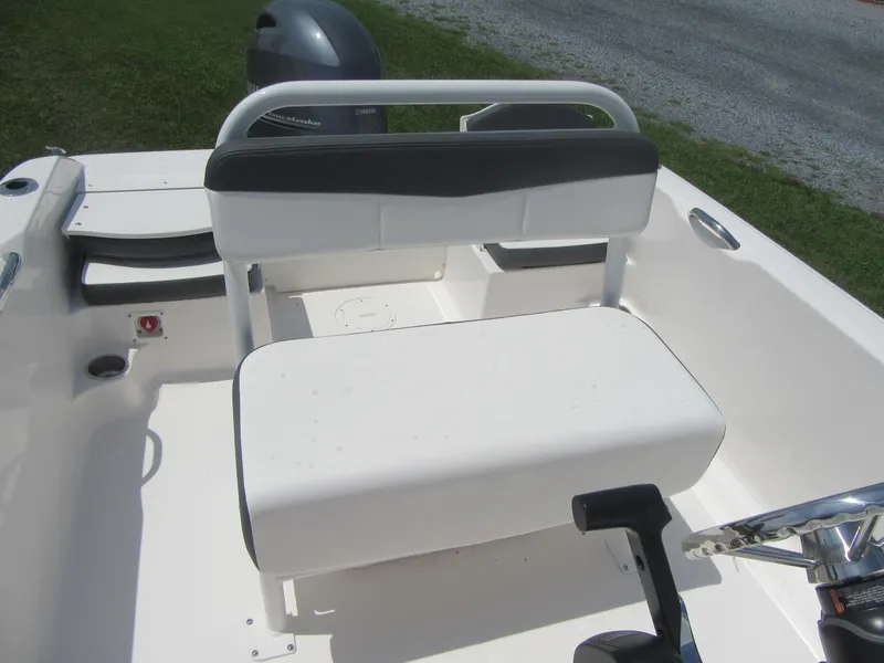 Slide: The Image of 2025 Robalo R160 Center Console boat interior with seating and steering wheel. - 9