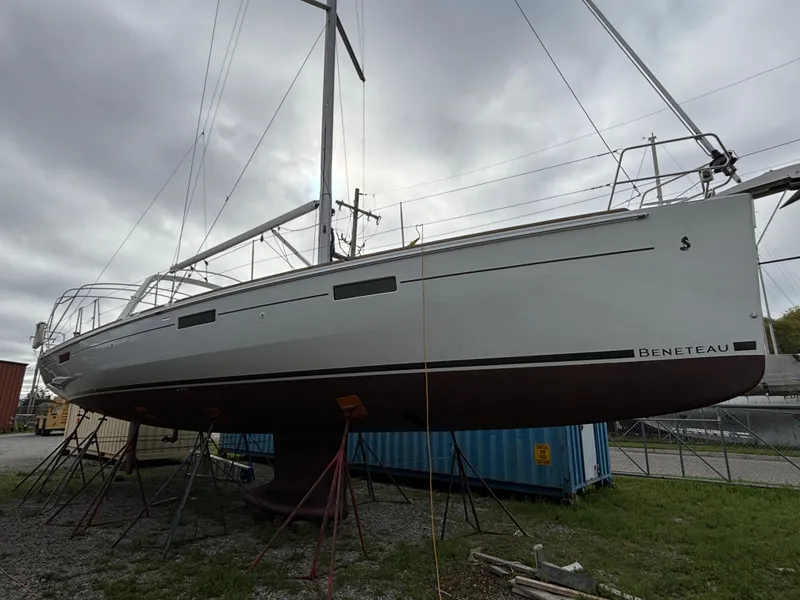 Slide: The Image of 2018 Beneteau Oceanis 45 sailboat on stands, overcast sky background. - 11