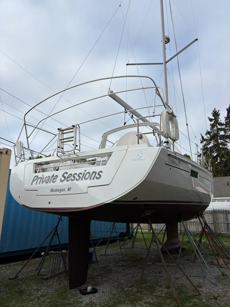 Slide: The Image of 2018 Beneteau Oceanis 45 sailboat named "Private Sessions" in Muskegon, MI, on stands. - 12