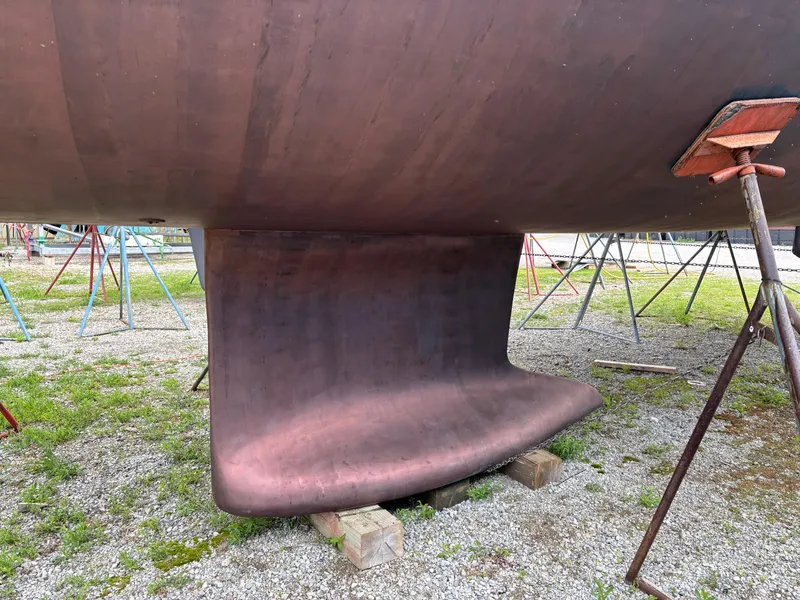 Slide: The Image of Keel of 2018 Beneteau Oceanis 45 sailboat on dry dock, supported by stands. - 18