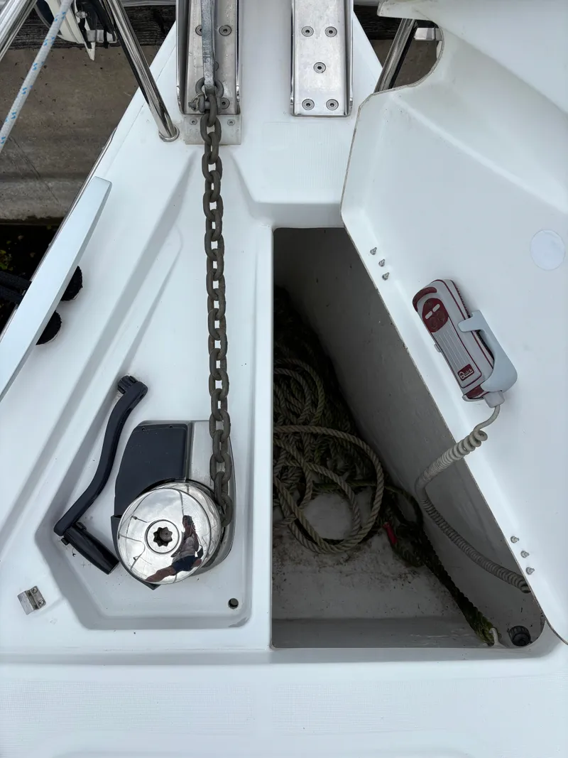 Slide: The Image of Anchor chain and storage compartment on a 2018 Beneteau Oceanis 45 sailboat deck. - 30