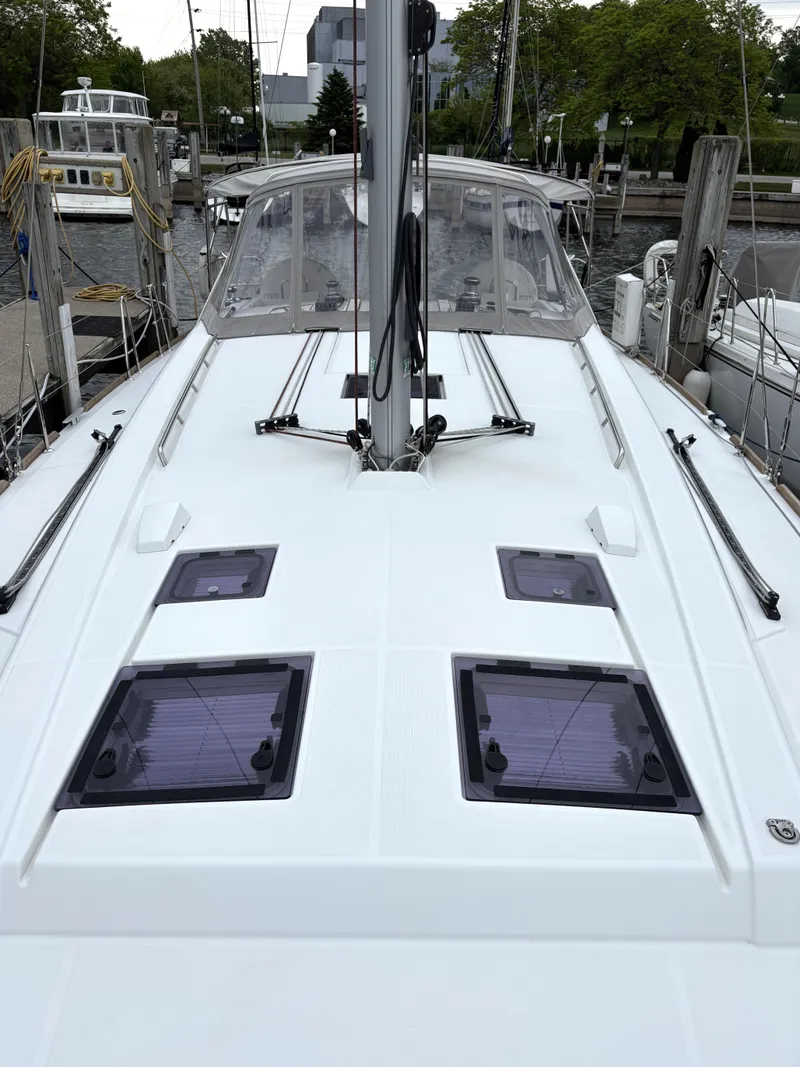 Slide: The Image of 2018 Beneteau Oceanis 45 sailboat deck with hatches, docked at marina. - 32