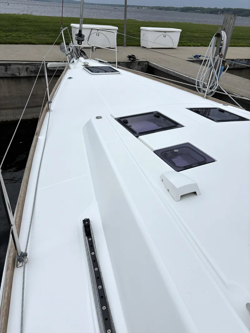 Slide: The Image of Beneteau Oceanis 45 sailboat deck, 2018 model, docked by the water. - 35
