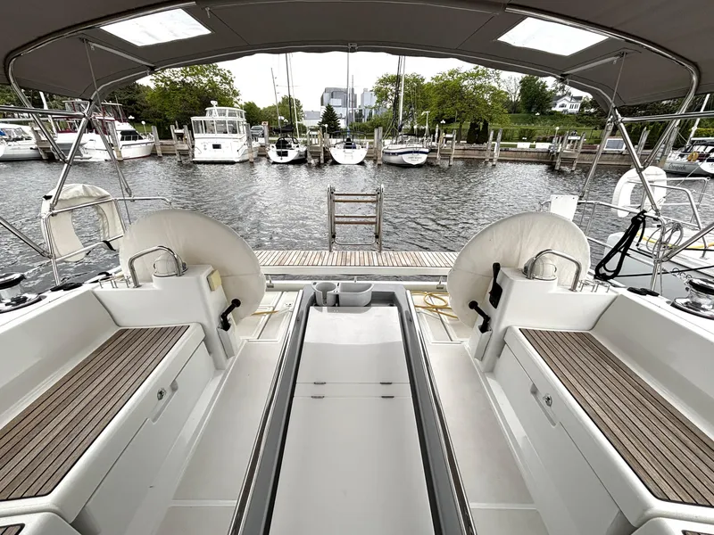 Slide: The Image of Beneteau Oceanis 45 yacht cockpit, 2018 model, docked at marina with scenic waterfront view. - 39