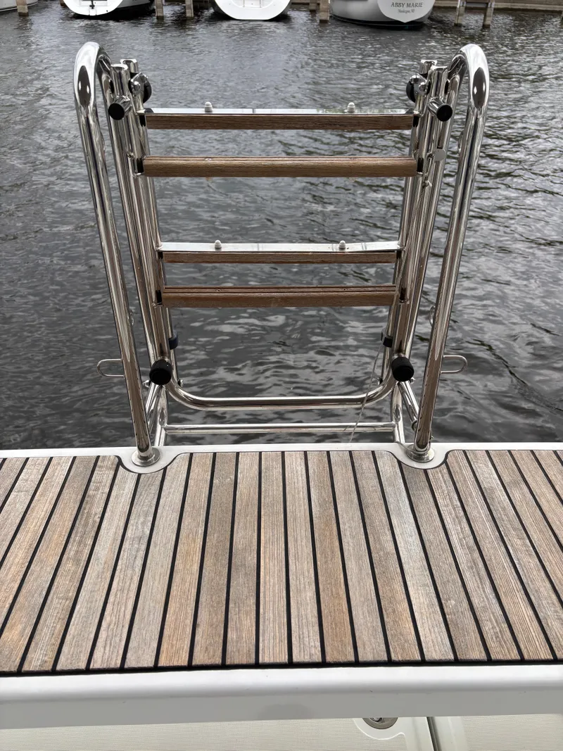 Slide: The Image of Stainless steel swim ladder on 2018 Beneteau Oceanis 45 yacht, dockside view. - 45
