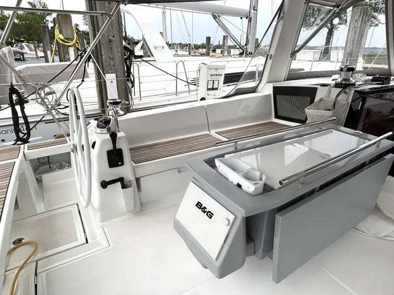 Slide: The Image of 2018 Beneteau Oceanis 45 yacht cockpit with steering wheel and navigation equipment. - 47
