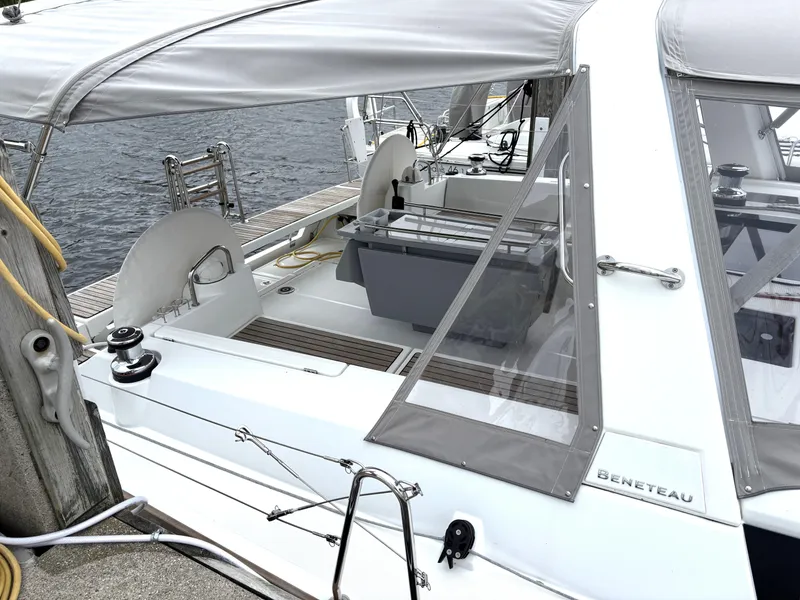 Slide: The Image of Beneteau Oceanis 45 sailboat, 2018 model, docked with covered cockpit and visible winch. - 5