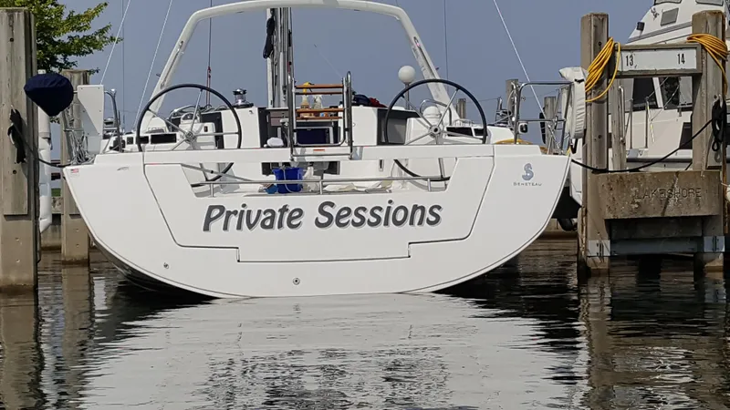 Slide: The Image of Beneteau Oceanis 45 sailboat named "Private Sessions" docked at marina, 2018 model. - 8