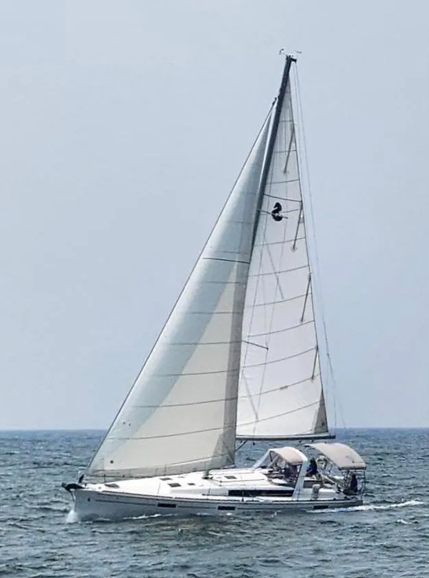 Slide: The Image of 2018 Beneteau Oceanis 45 sailing on open water under clear skies. - 9