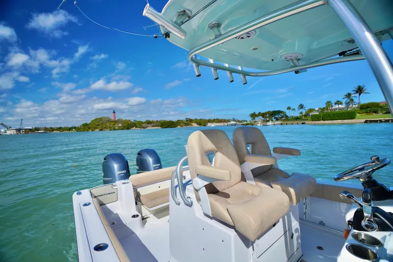 Slide: The Image of 2019 Sportsman Open 282 Center Console boat on clear blue water, sunny day. - 15