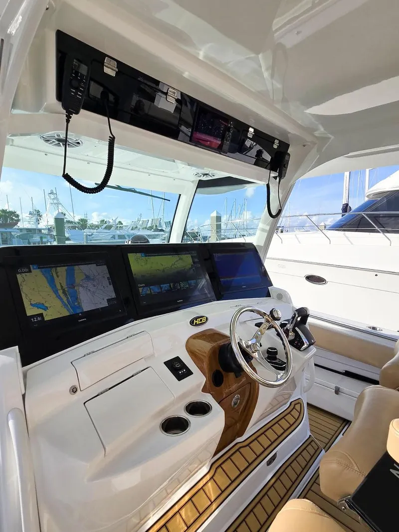 Slide: The Image of 2023 HCB Suenos boat dashboard with Garmin displays at marina. - 30