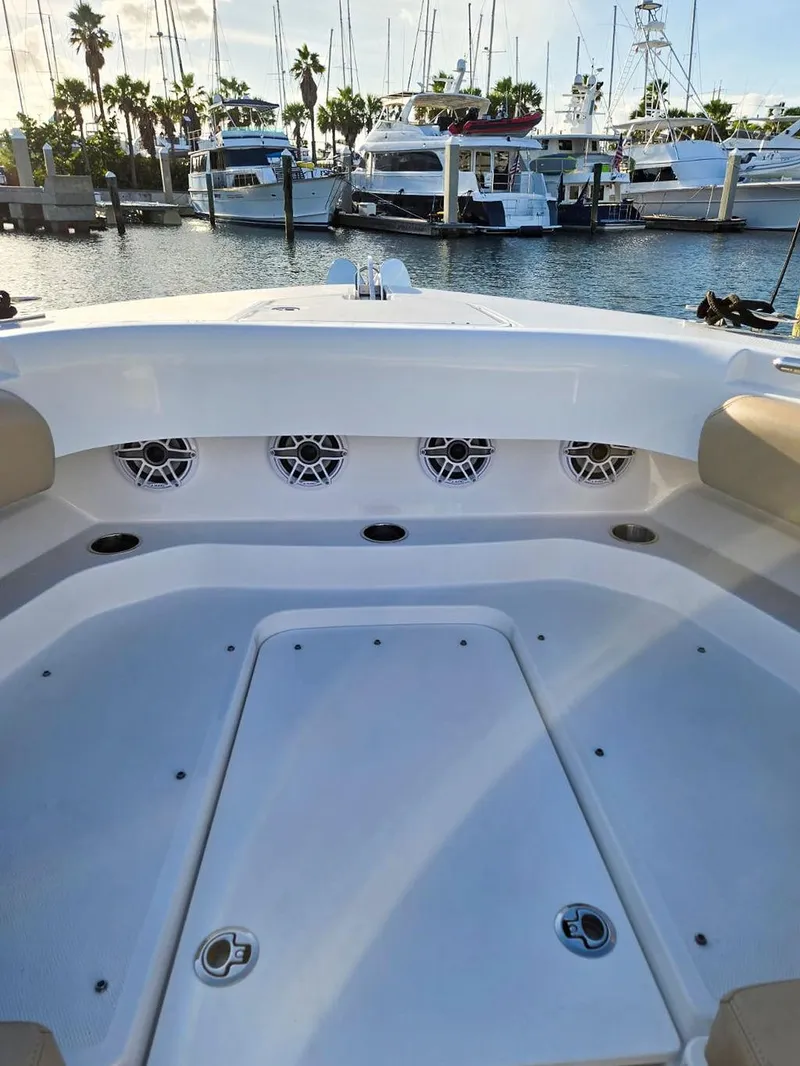 Slide: The Image of 2023 HCB Suenos boat with luxurious seating at a marina. - 46