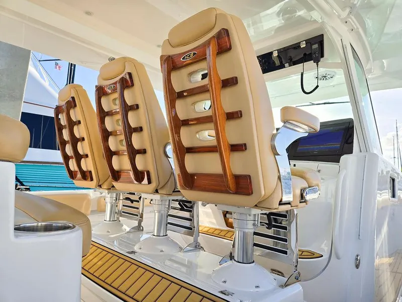 Slide: The Image of 2023 HCB Suenos boat control panel with joystick and switches for horn, wiper, and lights. - 26