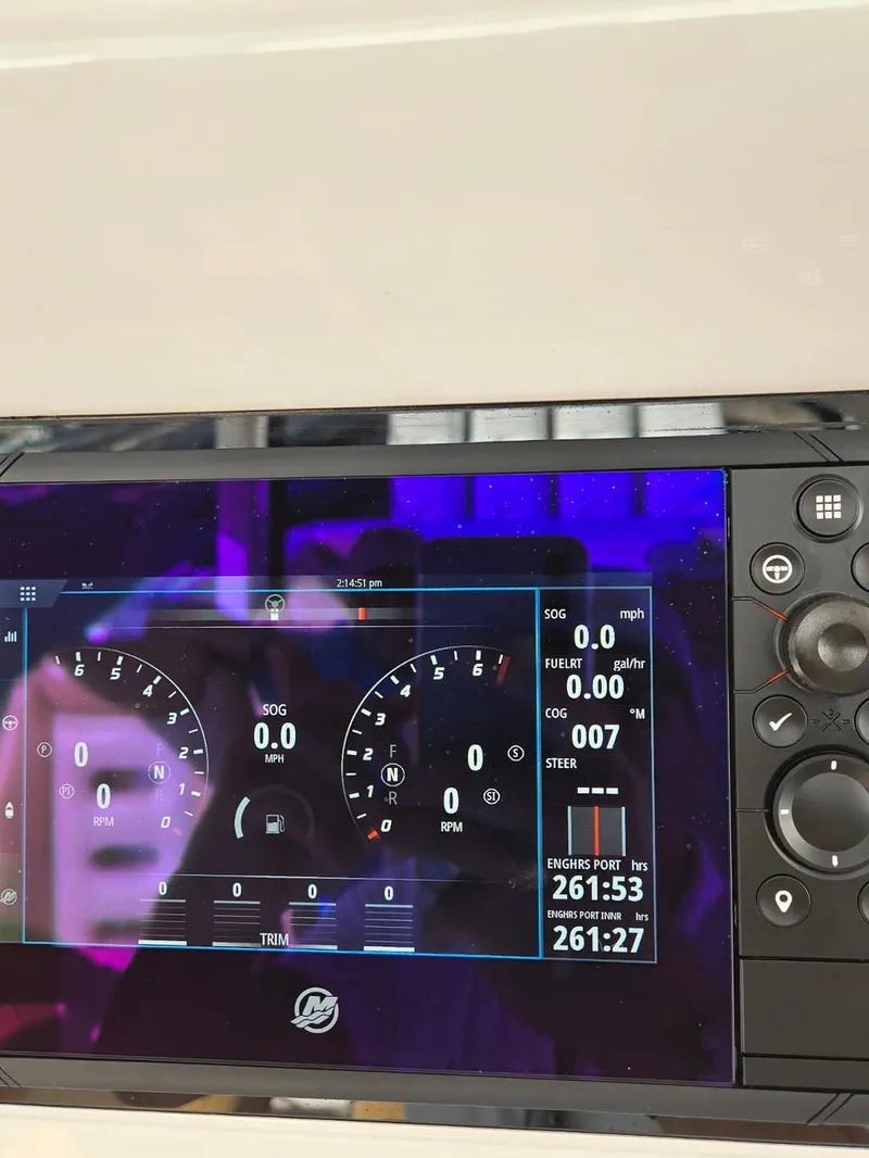 Slide: The Image of 2023 HCB Suenos boat dashboard with advanced navigation displays at marina. - 28