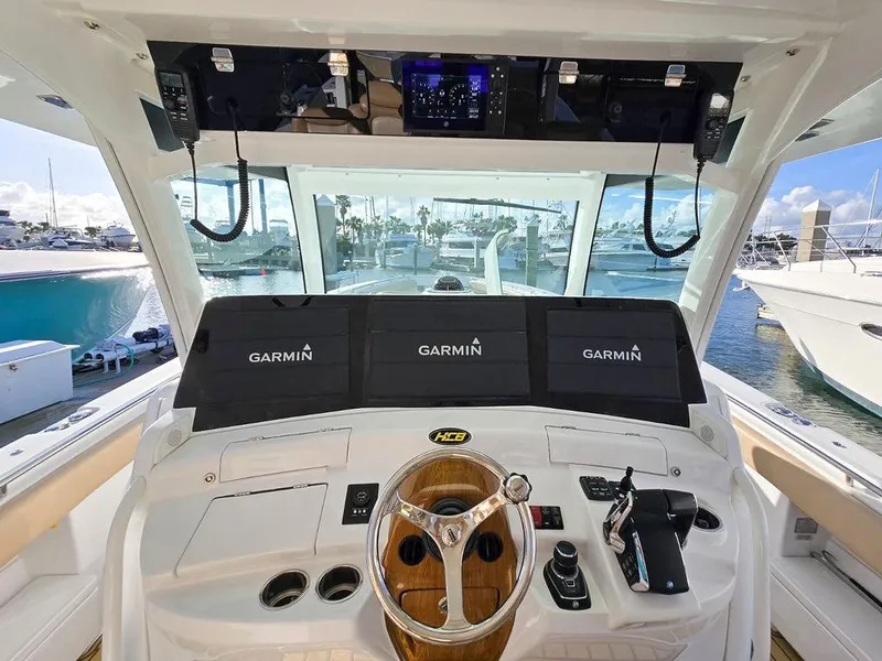 Slide: The Image of 2023 HCB Suenos boat interior with luxurious seating and advanced navigation controls. - 34