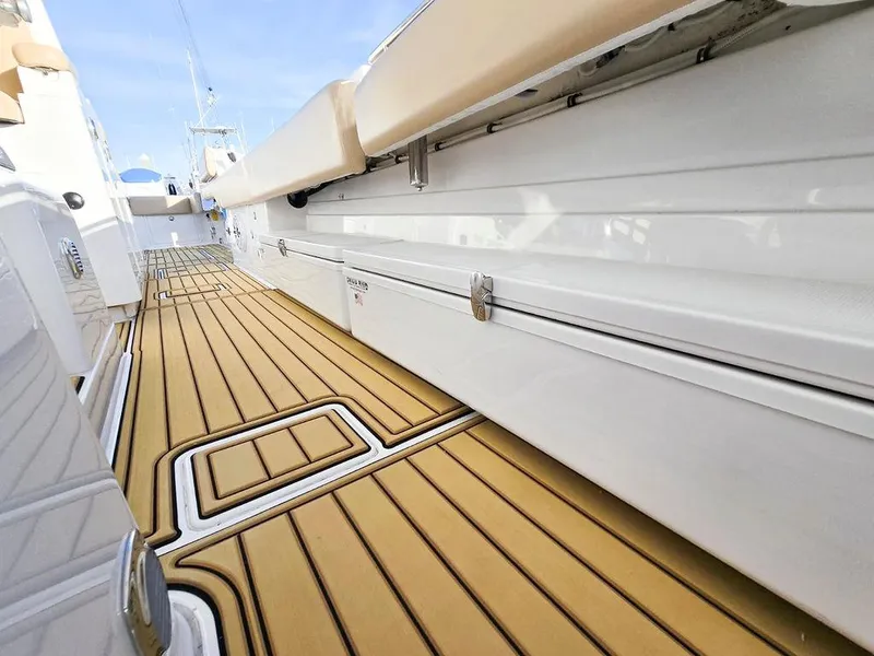 Slide: The Image of 2023 HCB Suenos boat speakers on deck with teak flooring. - 40