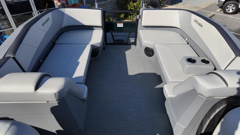 Slide: The Image of 2025 Sylvan A-22 LZ DH pontoon boat interior with gray seating and cup holders. - 5