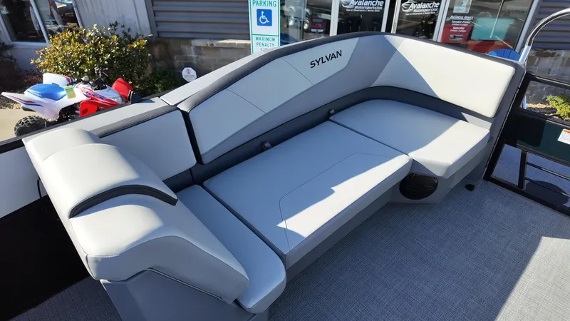 Slide: The Image of Luxurious seating on 2025 Sylvan A-22 LZ DH pontoon boat, featuring sleek gray upholstery. - 6