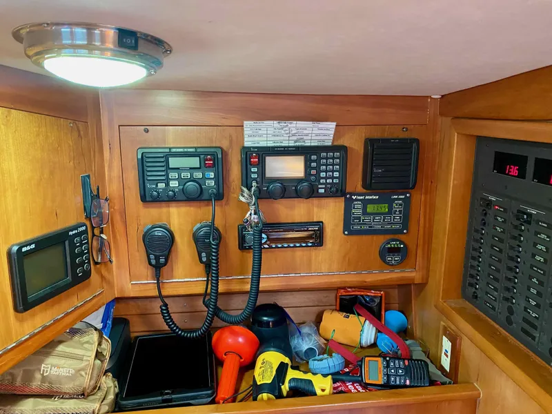 Slide: The Image of Navigation equipment and tools inside a 2001 J Boats J/46 yacht cabin. - 15