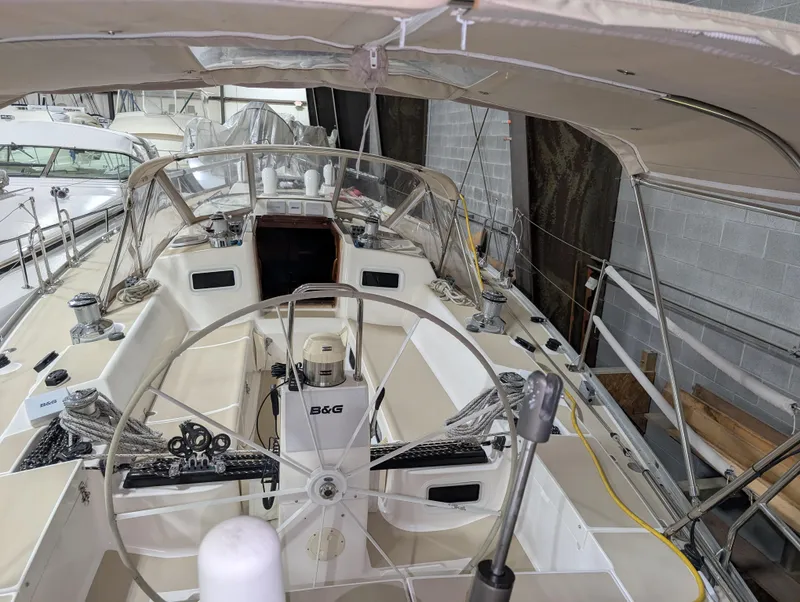 Slide: The Image of 2001 J Boats J/46 sailboat cockpit with steering wheel and navigation equipment. - 29