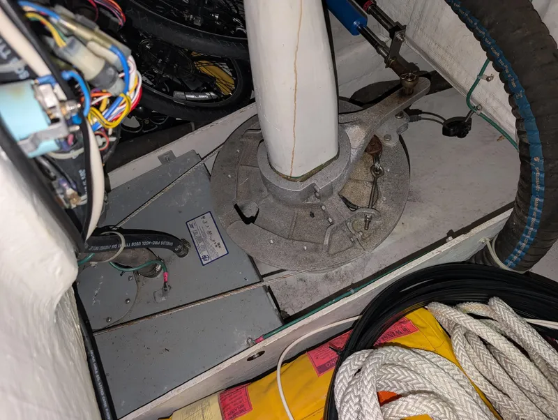 Slide: The Image of Engine compartment of a 2001 J Boats J/46 sailboat, showing wiring and mechanical components. - 39