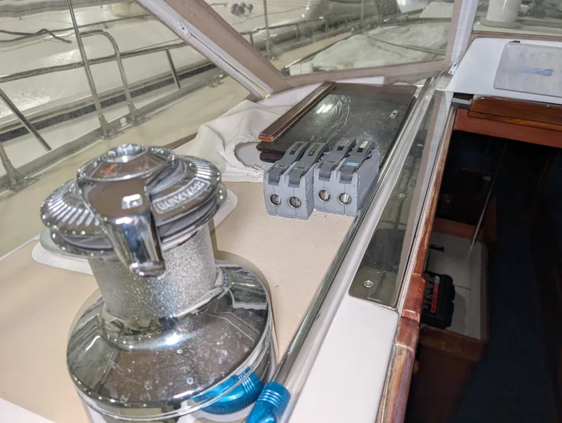 Slide: The Image of 2001 J Boats J/46 sailboat deck with winch and rope clutches. - 46