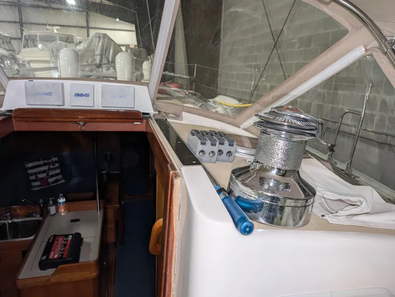 Slide: The Image of Interior view of a 2001 J Boats J/46 sailboat, showcasing winch and cabin entrance. - 48