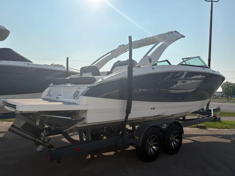 The Image of 2025 Regal LS9 Surf boat on trailer, sleek design, sunny day. - 0