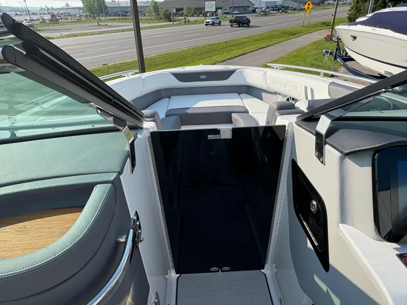 Slide: The Image of 2025 Regal LS9 Surf boat interior with open deck and seating area. - 12