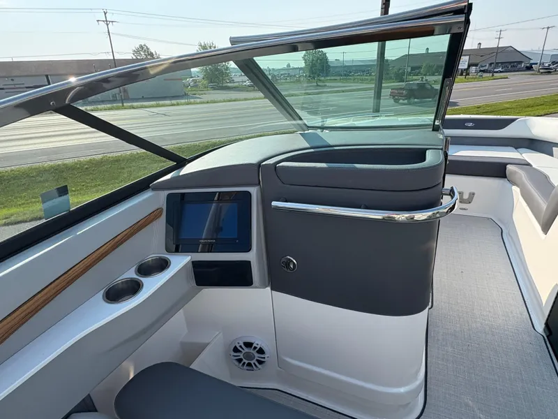 Slide: The Image of 2025 Regal LS9 Surf boat interior with modern dashboard and seating. - 24