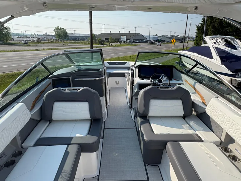 Slide: The Image of 2025 Regal LS9 Surf boat interior with modern seating and steering wheel. - 28