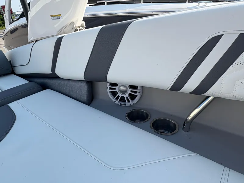 Slide: The Image of 2025 Regal LS9 Surf boat interior with speaker and cup holders. - 31