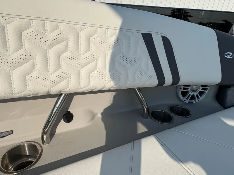 Slide: The Image of 2025 Regal LS9 Surf boat interior with stylish upholstery and cup holders. - 33