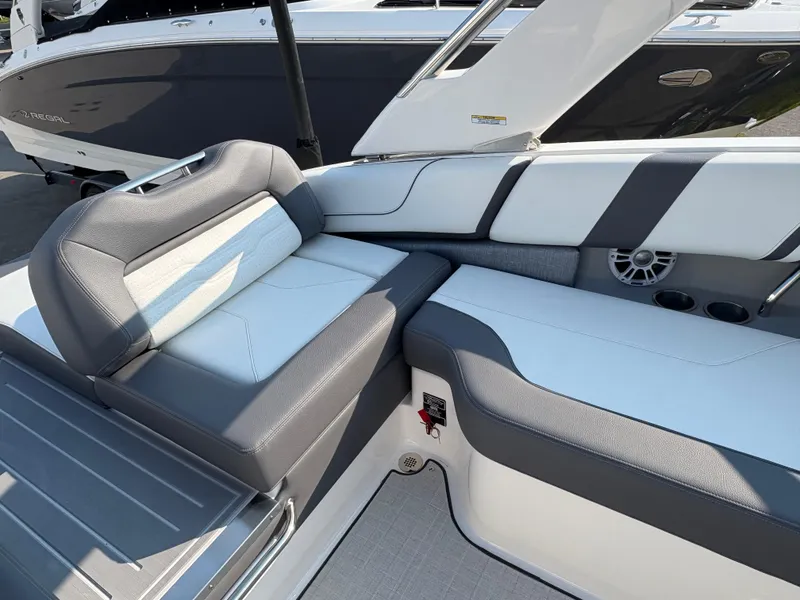 Slide: The Image of 2025 Regal LS9 Surf boat interior with gray and white seating. - 38