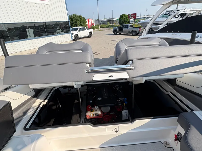Slide: The Image of 2025 Regal LS9 Surf boat engine compartment with open seating, showcasing modern design. - 39