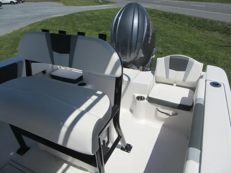 Slide: The Image of 2025 Robalo R180 Center Console boat interior with seating and outboard motor. - 13