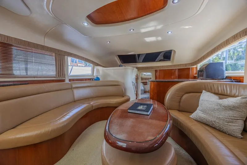 Slide: The Image of Luxurious interior of a 2005 Sea Ray 390 Motor Yacht with elegant seating and wooden accents. - 15