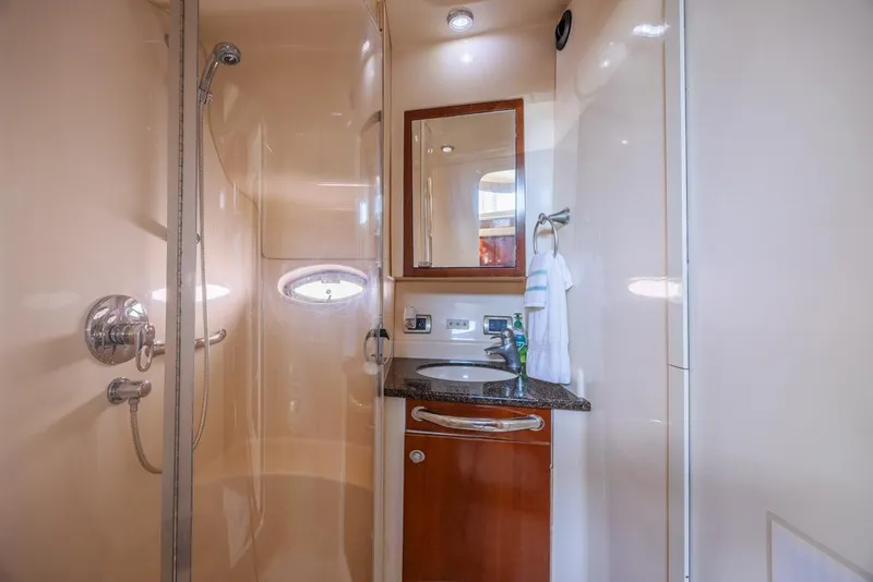 Slide: The Image of 2005 Sea Ray 390 Motor Yacht bathroom with shower, sink, and mirror. - 24