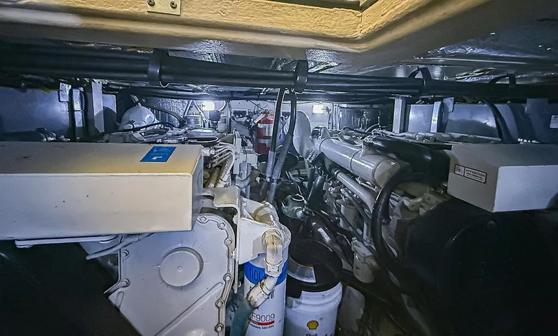 Slide: The Image of Engine room of 2005 Sea Ray 390 Motor Yacht, showcasing machinery and equipment. - 28