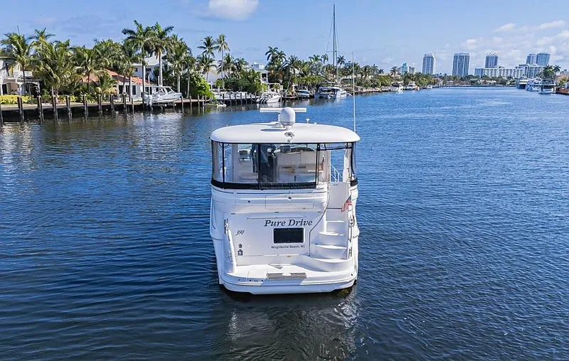 Slide: The Image of 2005 Sea Ray 390 Motor Yacht cruising on a scenic waterway. - 3