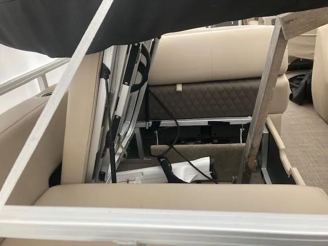 Slide: The Image of 2023 Sun Tracker PB 22 RF interior seating and storage area. - 13