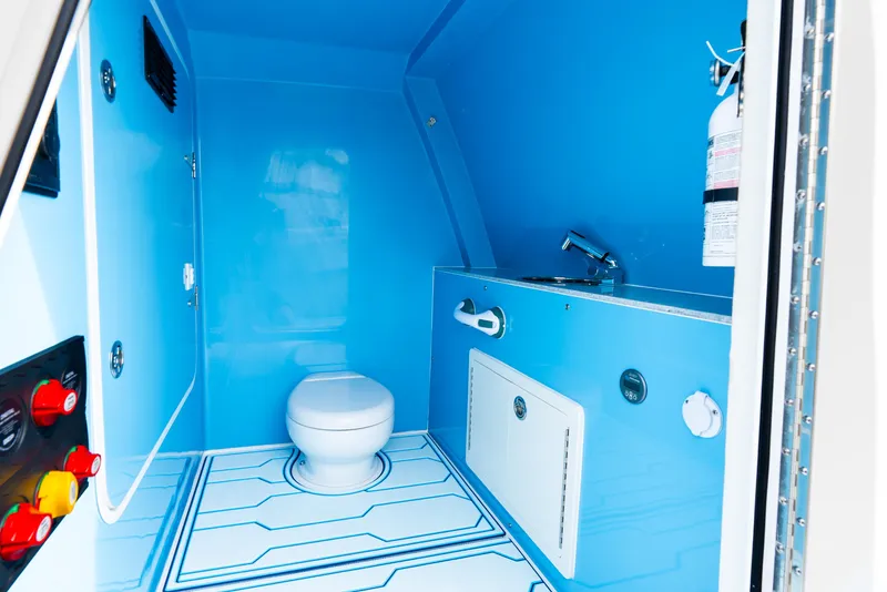 Slide: The Image of 2025 Insetta 35IFC boat interior bathroom with blue design and modern fixtures. - 14