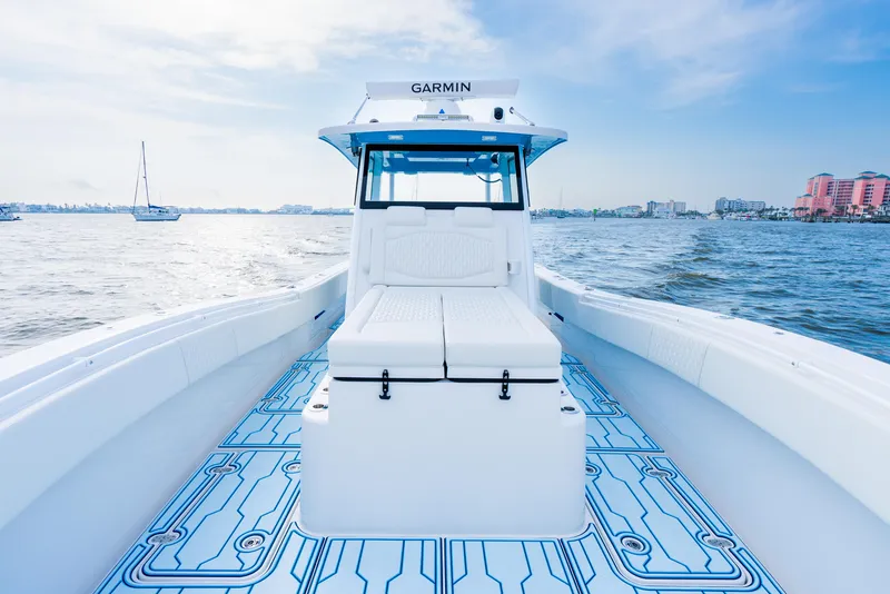 Slide: The Image of 2025 Insetta 35IFC boat on water, featuring sleek design and modern navigation equipment. - 6