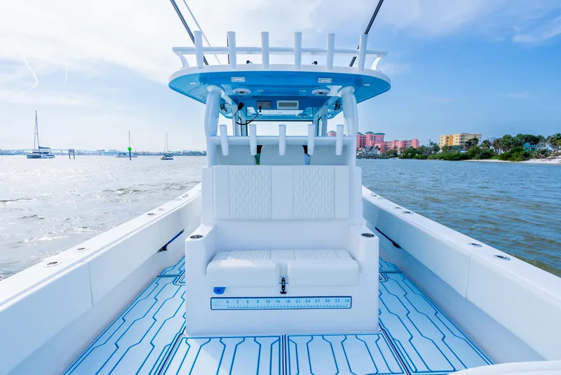 Slide: The Image of 2025 Insetta 35IFC boat interior with modern seating, on a sunny day at sea. - 9