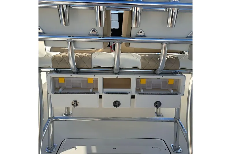 Slide: The Image of 2026 Bulls Bay 255 Center Console boat storage compartments and rod holders. - 11