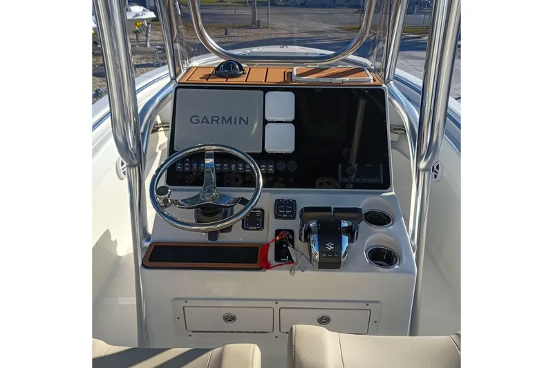 Slide: The Image of 2026 Bulls Bay 255 Center Console boat dashboard with Garmin navigation system. - 12