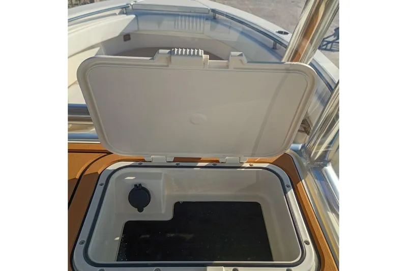 Slide: The Image of Open storage compartment on 2026 Bulls Bay 255 Center Console boat. - 17