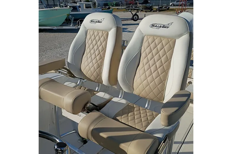 Slide: The Image of 2026 Bulls Bay 255 Center Console boat seats with diamond-pattern upholstery. - 24